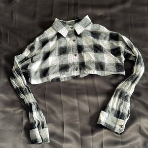 Plaid long sleeve flannel, cropped, loose at bottom.